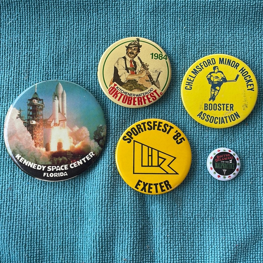Five vintage pin-back buttons